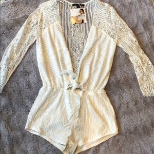 White low cut lace romper.